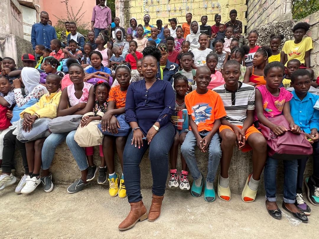 School kids in Haiti with two instructors