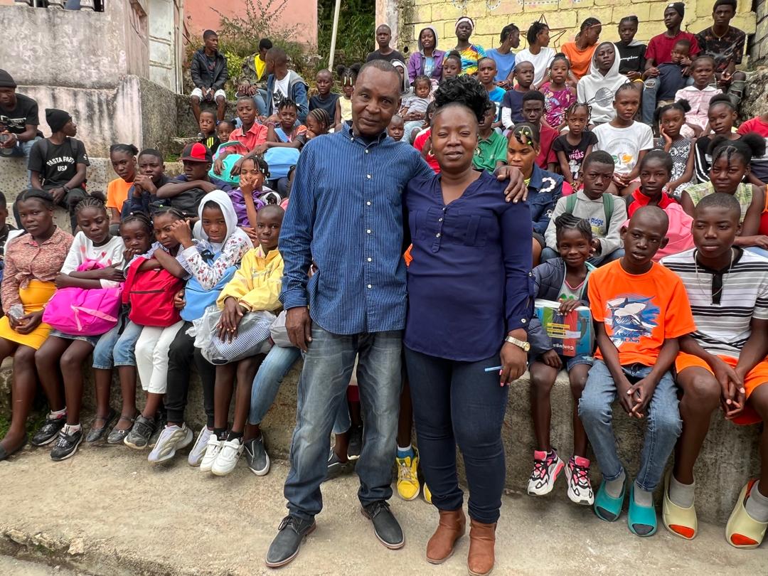 School kids in Haiti with two instructors